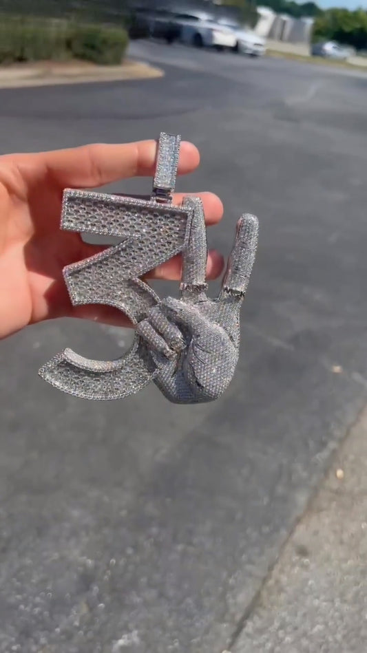 Side view of the hip-hop pendant, highlighting its intricate diamond arrangement and bold craftsmanship