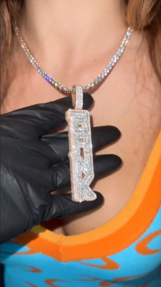 Zoomed-out view of the vertical BANK pendant, highlighting its luxurious style and sterling silver finish