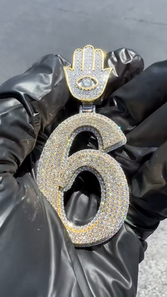 Close-up of the '6' number pendant with round diamonds and Hamza cluster, emphasizing intricate detailing