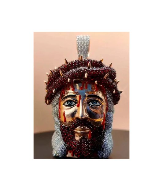 Front view of a Jesus face pendant featuring a crown adorned with red round diamonds