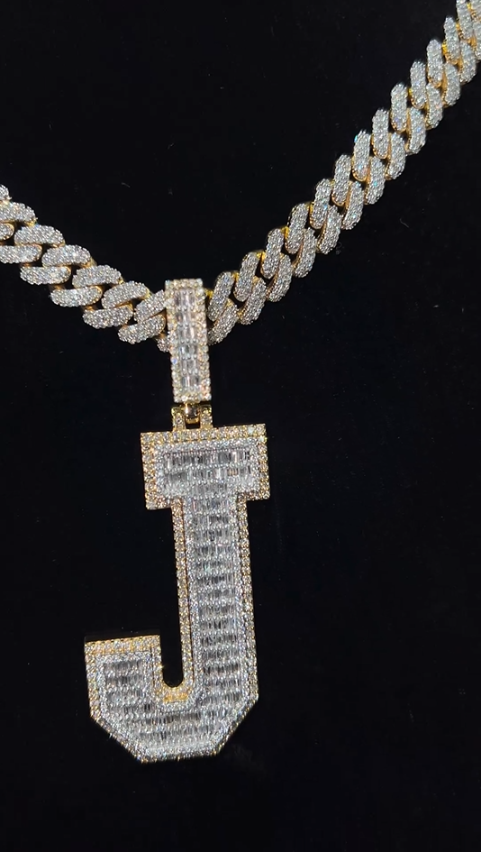 Close-up of the J pendant with Miami Cuban chain, showcasing its detailed gold and silver 2-tone finish