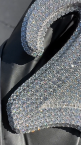 Close-up of the '2X' letter pendant, emphasizing the sparkle of round-cut Moissanite and CZ stones
