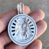 Back view of a silver unisex charm Jesus round pendant