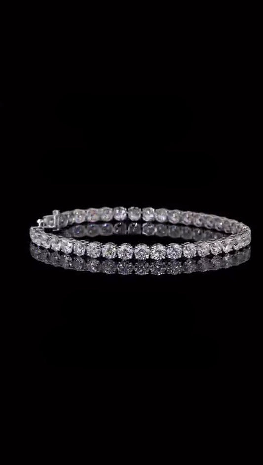Side angle of round diamond tennis bracelet in sterling silver, classic and clean finish