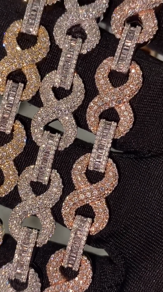 Close-up of diamond-style stones on infinity bracelet, set in polished sterling silver for bold shine