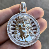 Front view of a unisex charm Jesus round pendant in silver