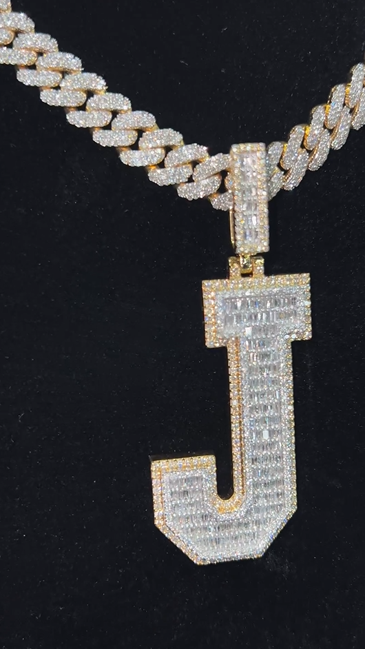 Angled view of the J pendant paired with a Miami Cuban chain, capturing its bold 2-tone design