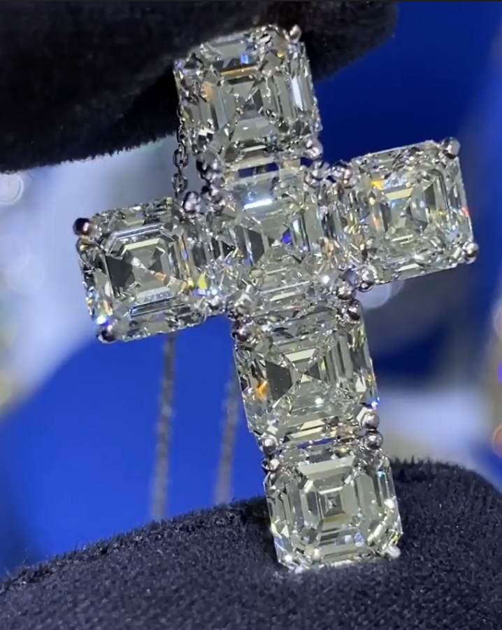Close-up of the Ascher cut cross pendant, featuring sparkling colorless VVS Moissanite stones in sterling silver
