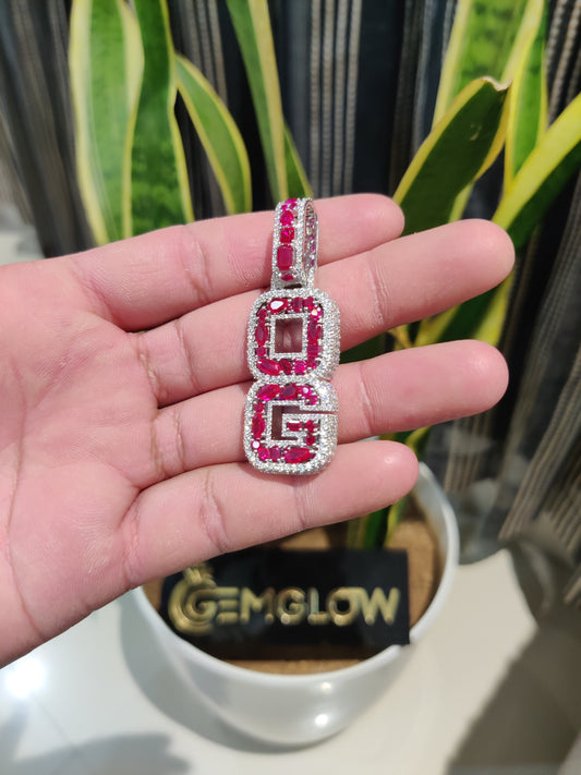 Right side view of a fully iced 'OG' letter pendant 