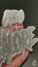 Close-up of iced-out silver name pendant, handcrafted in 925 silver with sparkling diamond accents