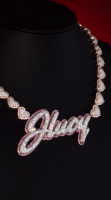 Custom letter pendant with heart-shaped chain, iced-out design