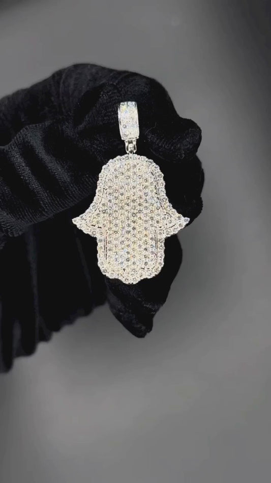 Video of Hamsa hand pendant with round-cut Moissanite or CZ diamonds in sterling silver, showcasing hip-hop style